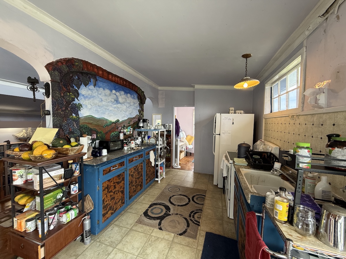 37 Mehau Lane Hilo, HI 96720 - Photo 11 of 24 a room with lots of wooden furniture and a potted plant