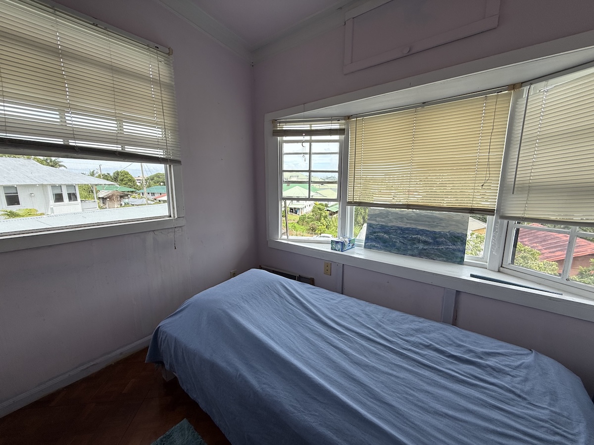 37 Mehau Lane Hilo, HI 96720 - Photo 12 of 24 a bedroom with a bed and a window