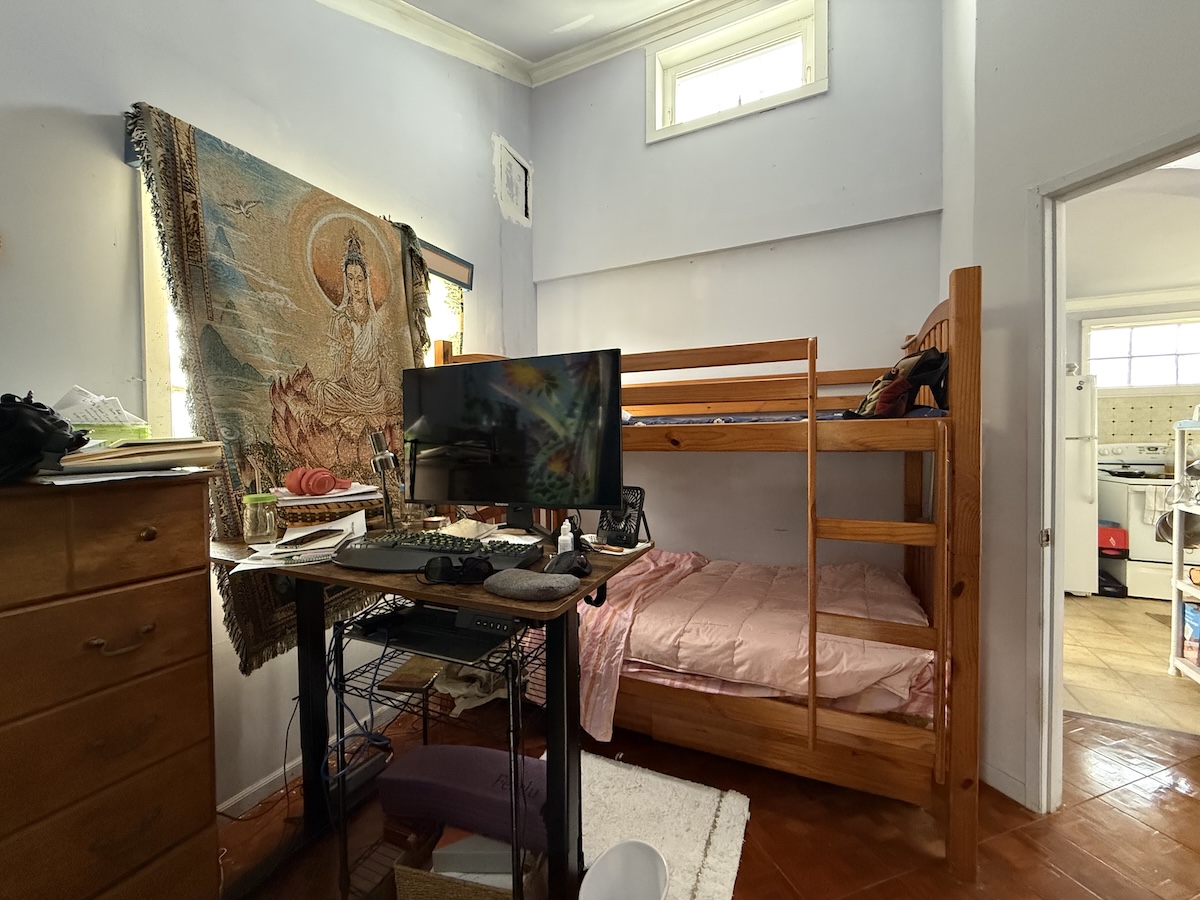 37 Mehau Lane Hilo, HI 96720 - Photo 13 of 24 a bedroom with a bed and a tv