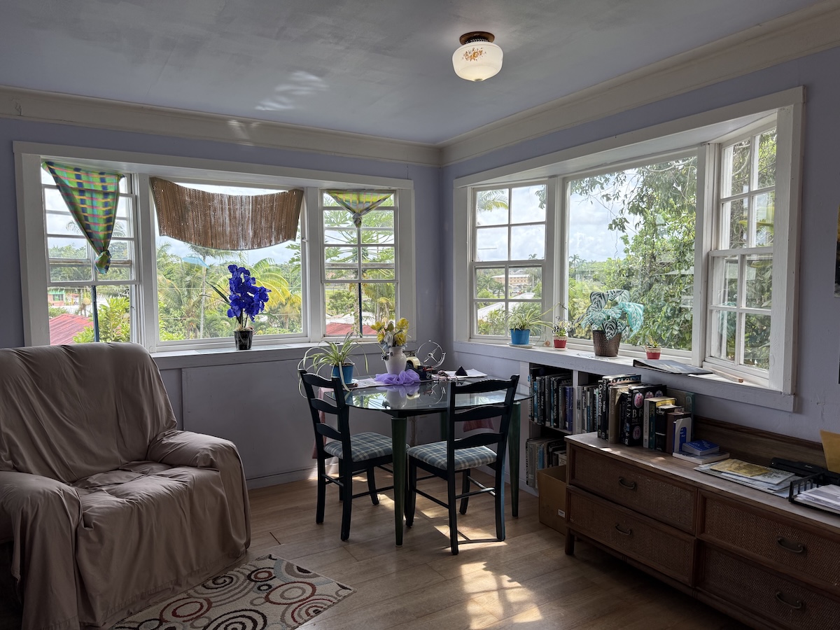 37 Mehau Lane Hilo, HI 96720 - Photo 17 of 24 a view of a dining room with furniture large windows and wooden floor