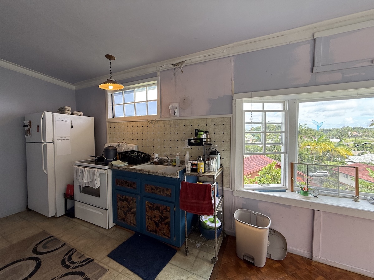 37 Mehau Lane Hilo, HI 96720 - Photo 10 of 24 a kitchen with a refrigerator and a sink