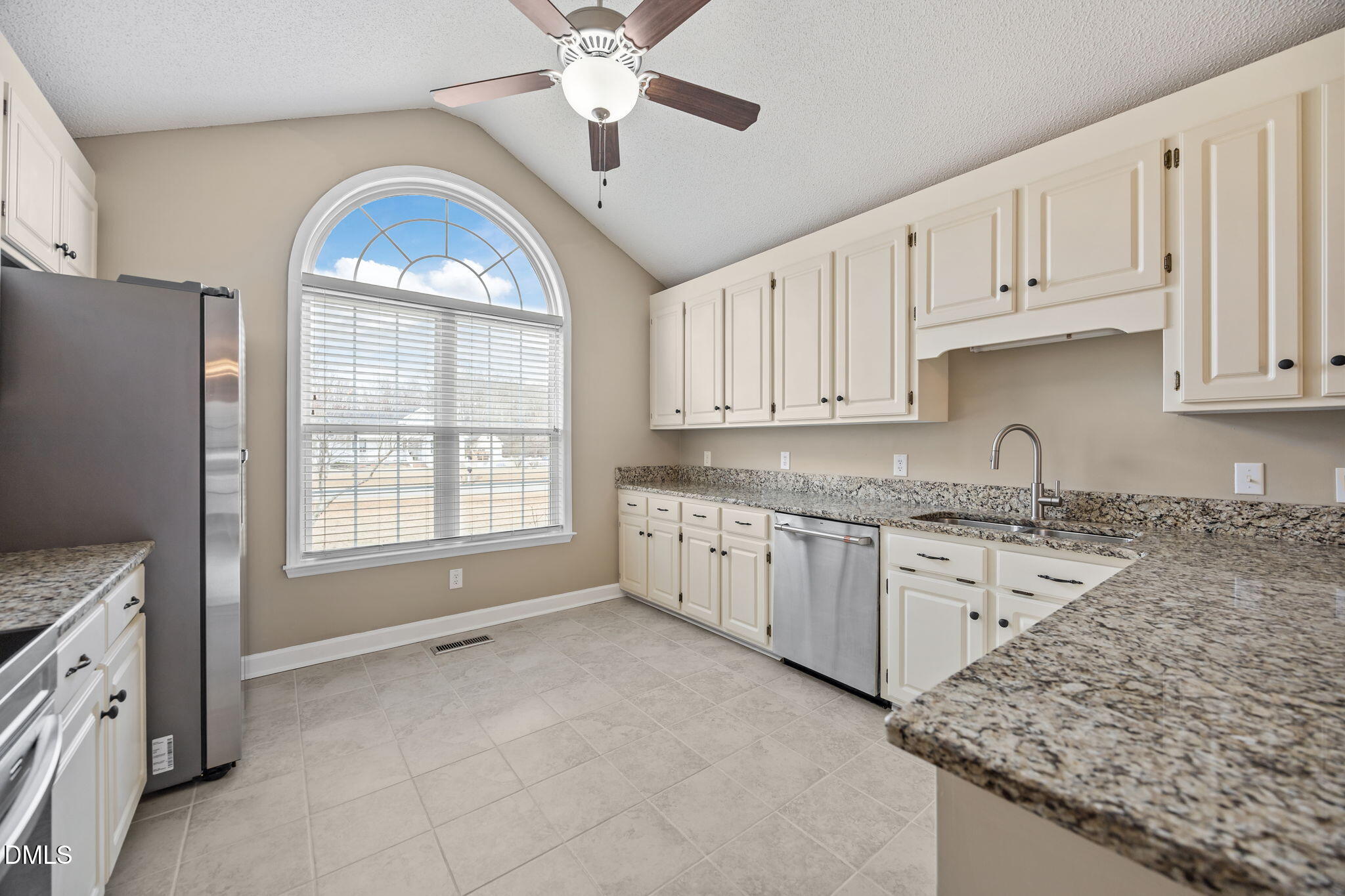 115 Edmondson Drive Willow Spring, NC 27592 - Photo 12 of 39 a open kitchen with granite countertop a stove sink and cabinets