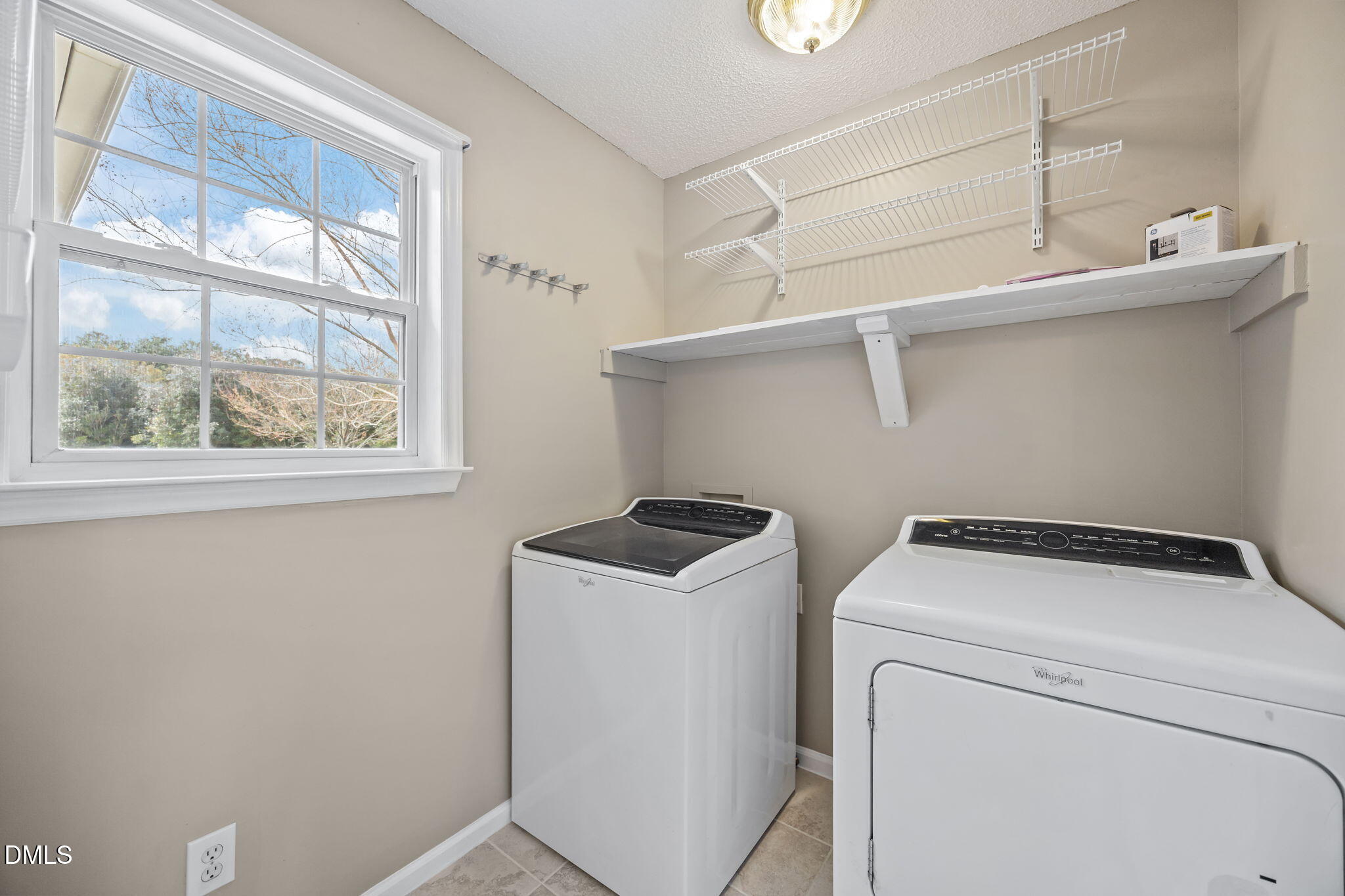 115 Edmondson Drive Willow Spring, NC 27592 - Photo 14 of 39 a utility room with dryer and washer