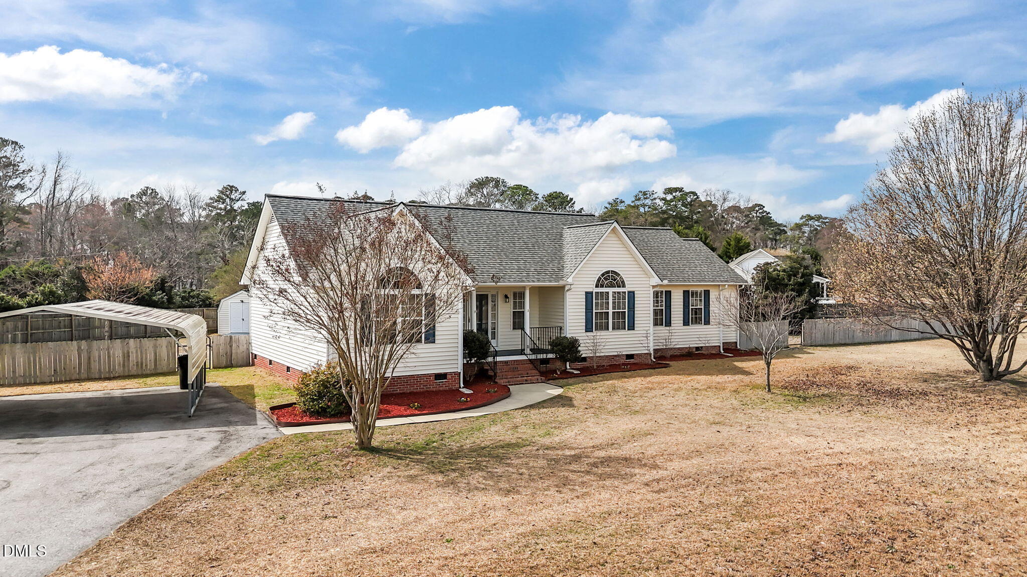 115 Edmondson Drive Willow Spring, NC 27592 - Photo 2 of 39 a view of a house with a yard