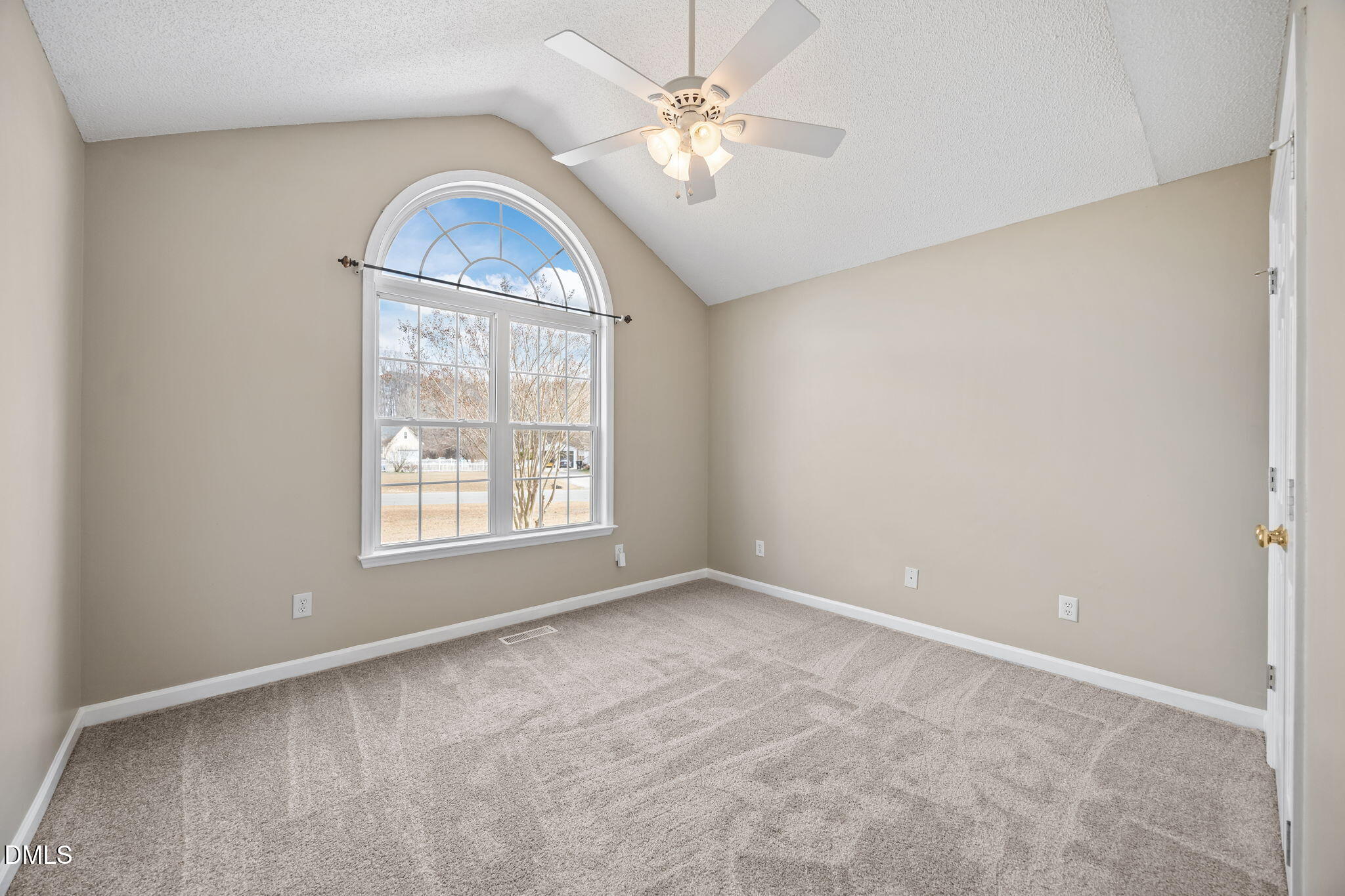 115 Edmondson Drive Willow Spring, NC 27592 - Photo 21 of 39 an empty room with chandelier fan and window