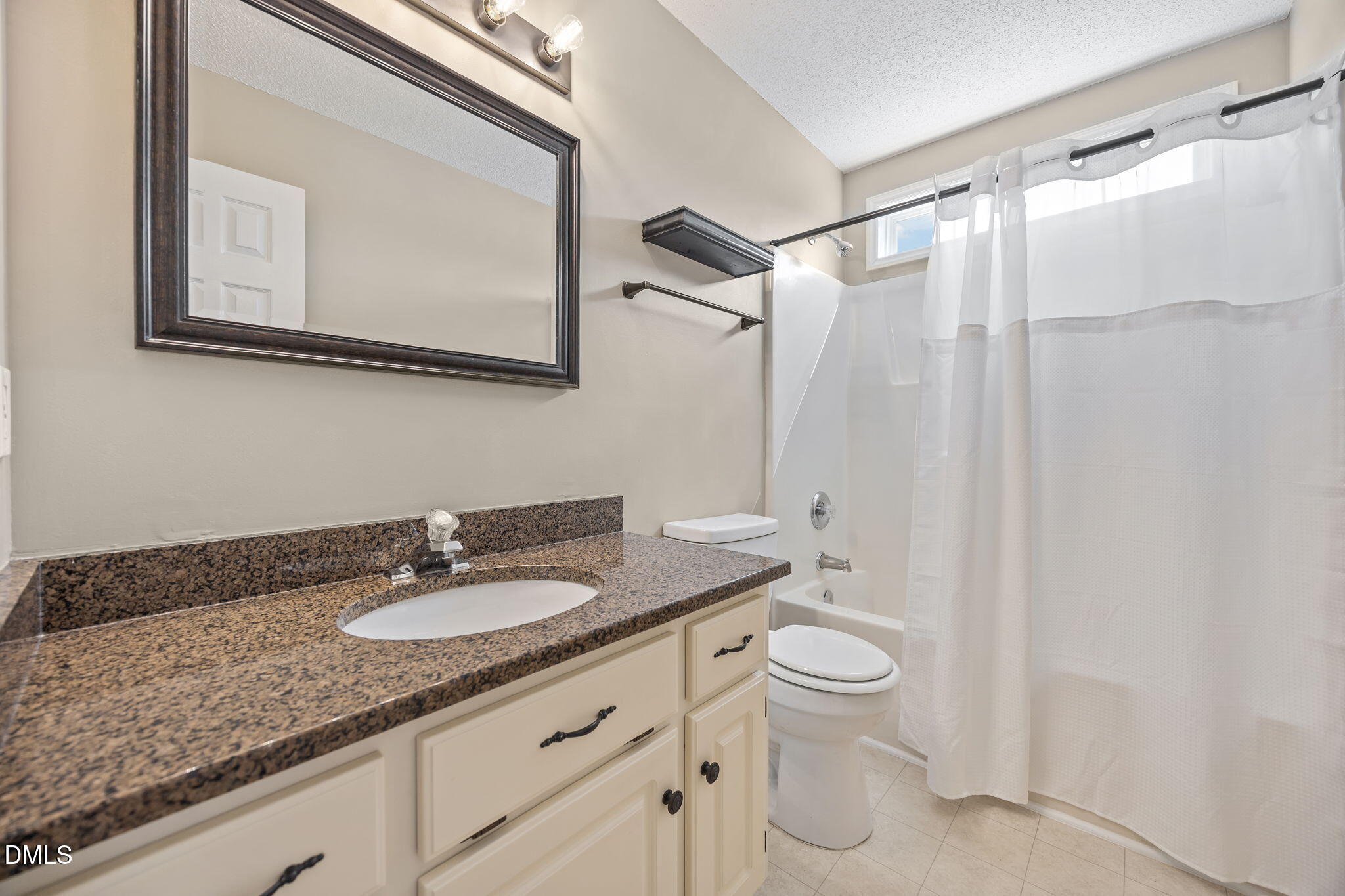 115 Edmondson Drive Willow Spring, NC 27592 - Photo 23 of 39 a bathroom with a granite countertop sink toilet and shower