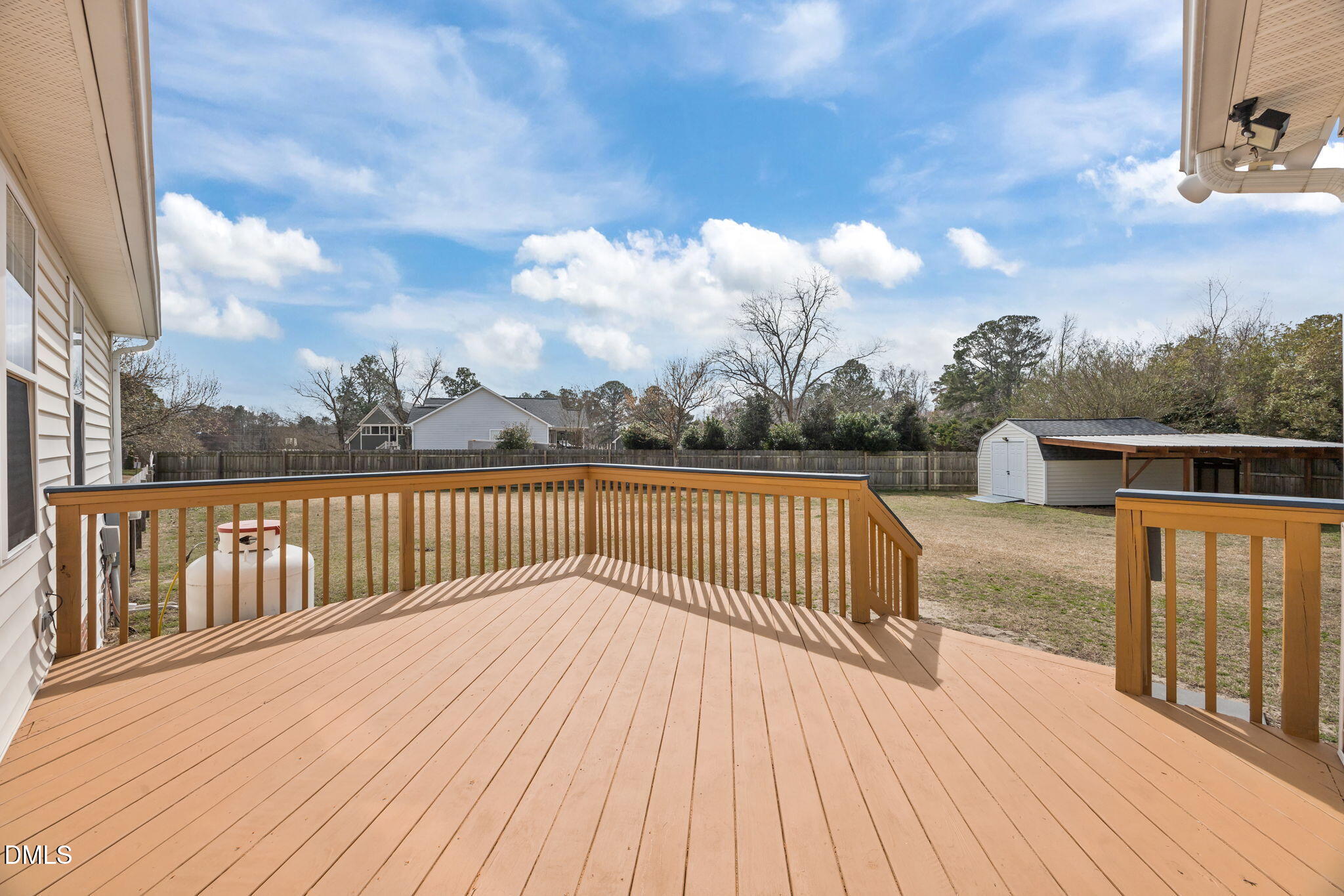 115 Edmondson Drive Willow Spring, NC 27592 - Photo 29 of 39 a view of balcony with wooden floor and fence