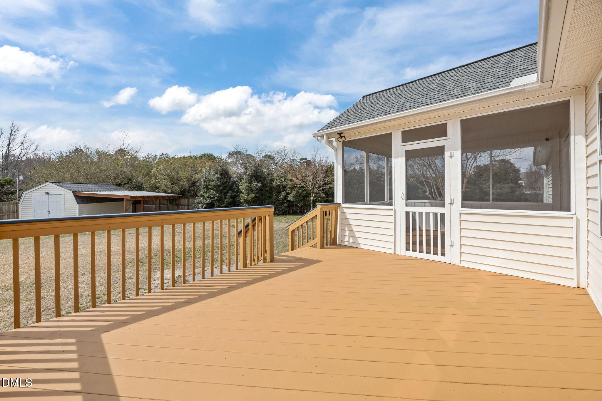 115 Edmondson Drive Willow Spring, NC 27592 - Photo 30 of 39 a balcony view with a garden