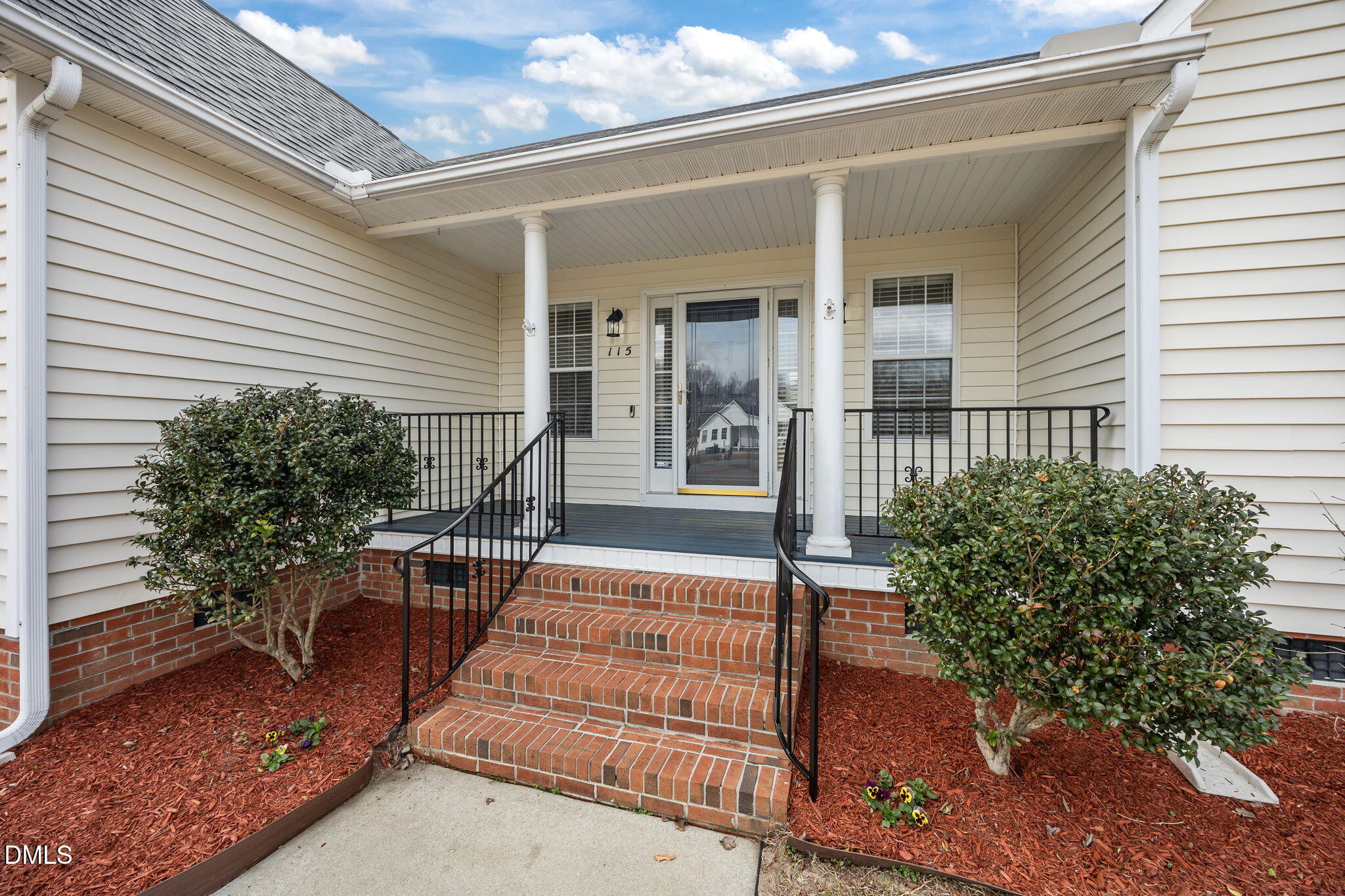 115 Edmondson Drive Willow Spring, NC 27592 - Photo 3 of 39 a porch with seating space