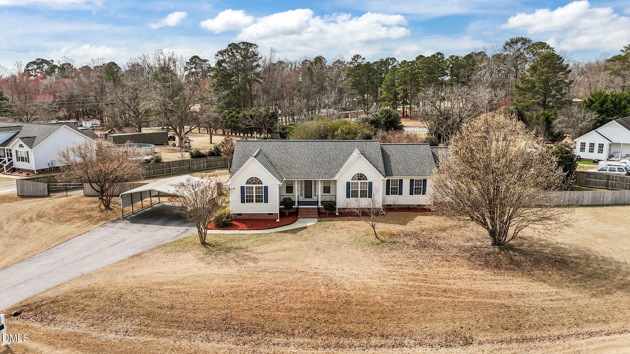 115 Edmondson Drive Willow Spring, NC 27592 - Photo 32 of 39 an aerial view of a house with a yard covered in snow