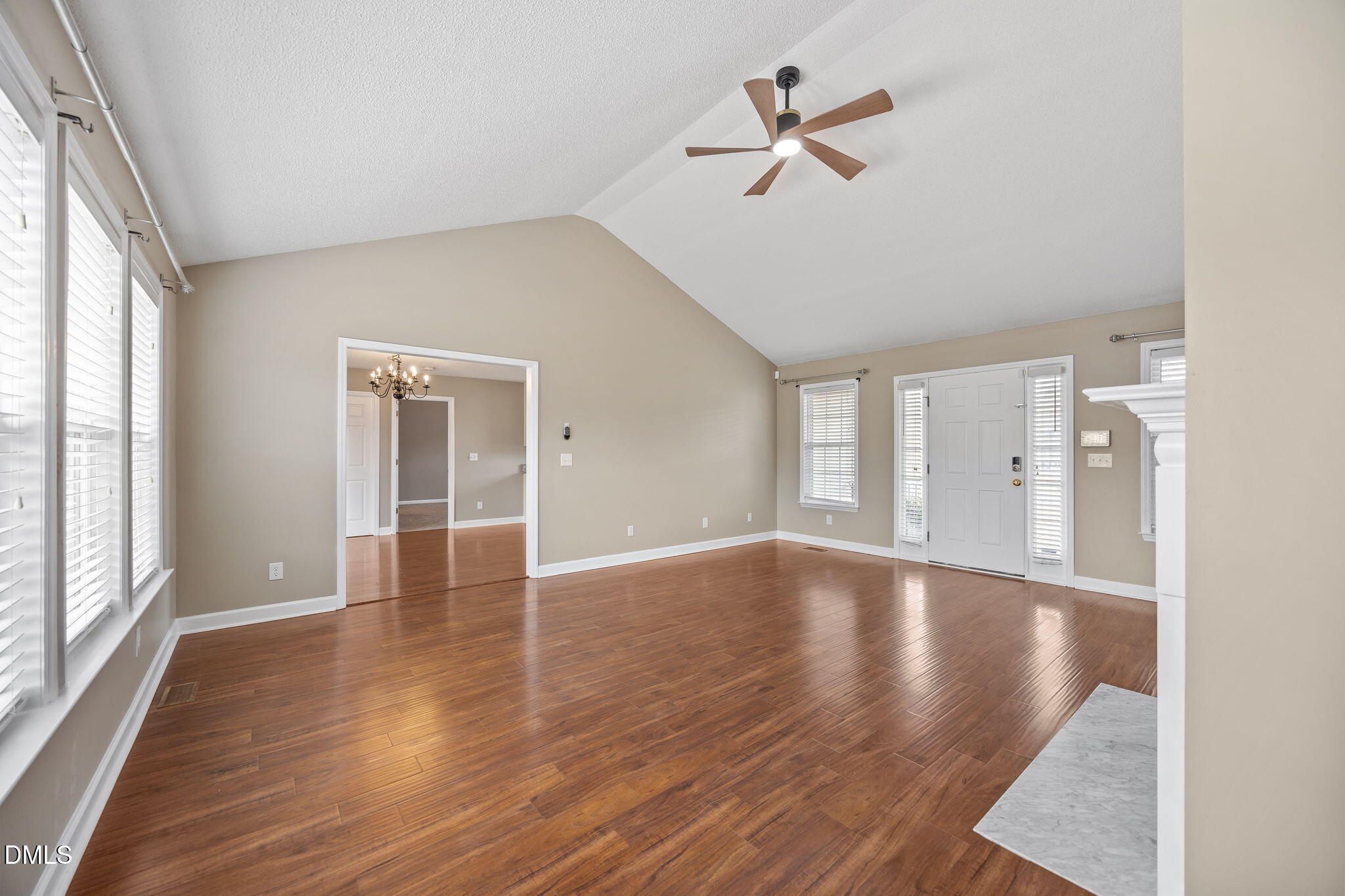115 Edmondson Drive Willow Spring, NC 27592 - Photo 6 of 39 wooden floor in an empty room with a window