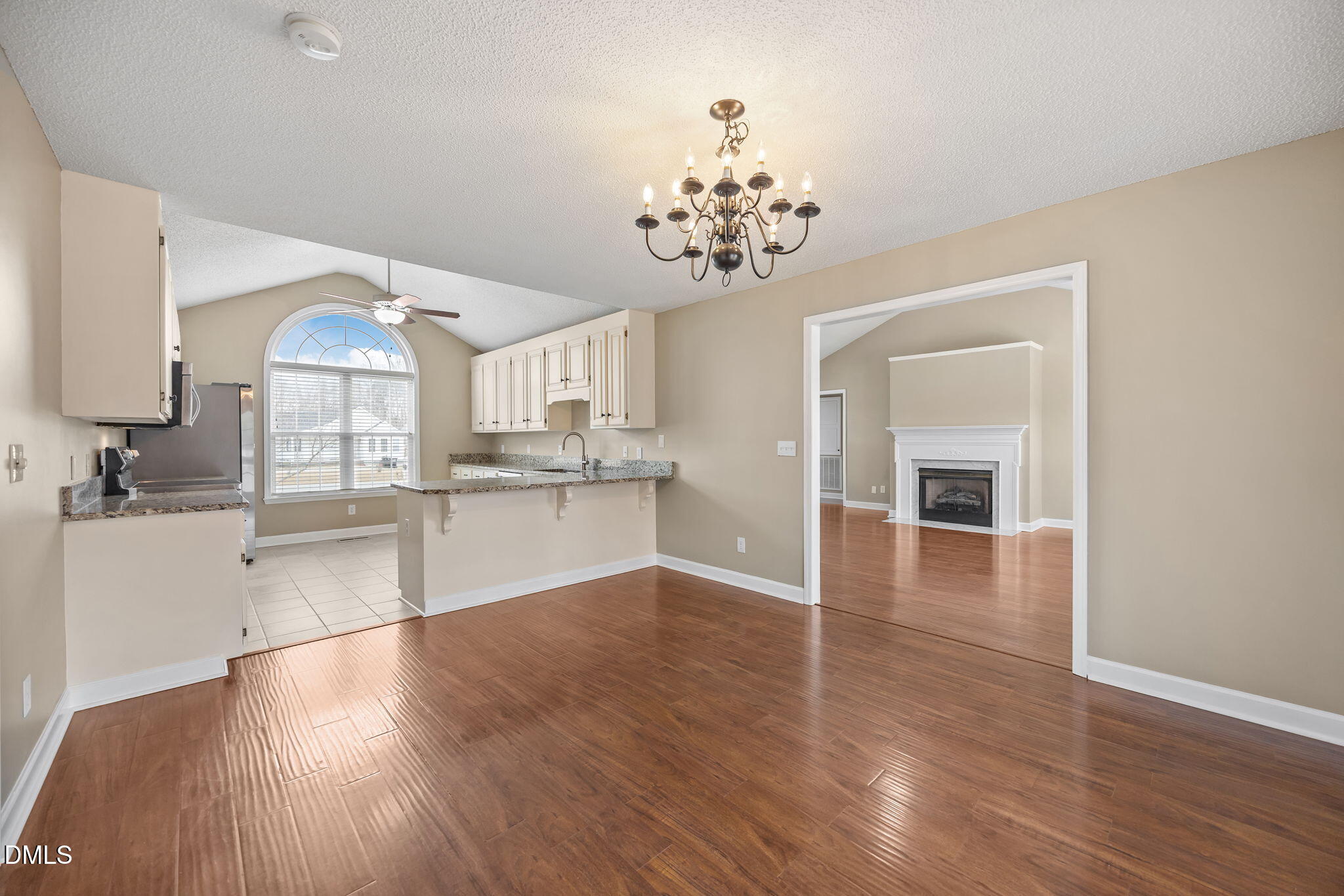 115 Edmondson Drive Willow Spring, NC 27592 - Photo 8 of 39 a view of a kitchen with a sink cabinets and wooden floor