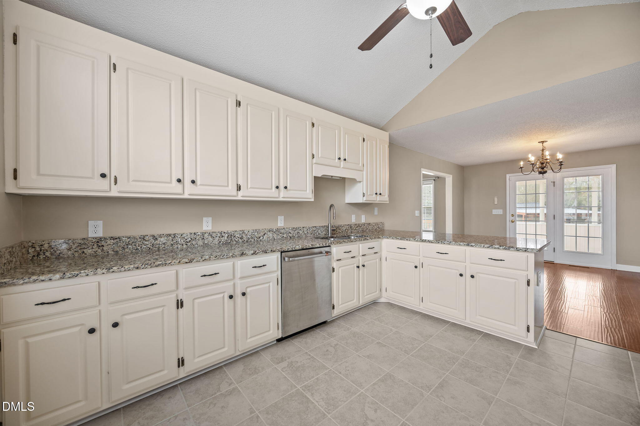 115 Edmondson Drive Willow Spring, NC 27592 - Photo 10 of 39 a large white kitchen with granite countertop stainless steel appliances