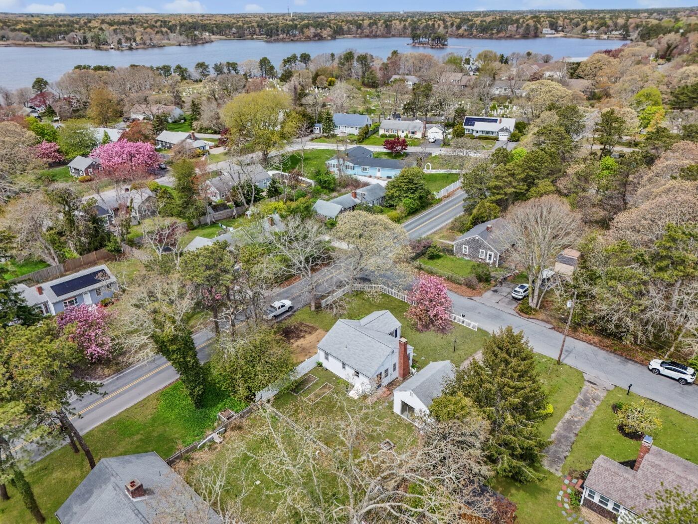 1 Gilbert Road Dennis Port, MA 02639 - Photo 5 of 27 an aerial view of a house with a yard