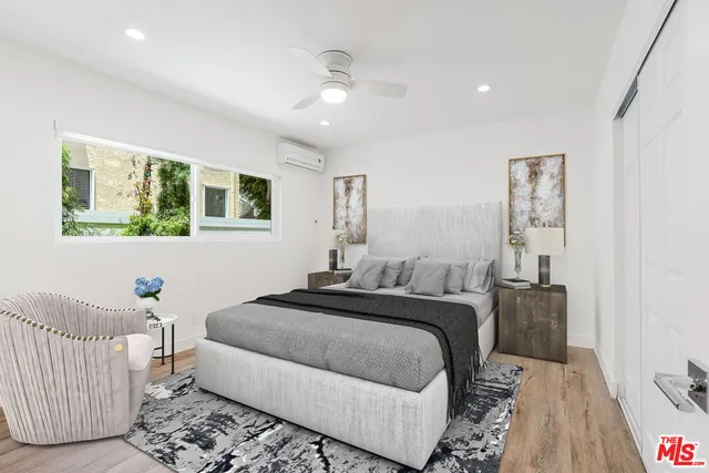 a bed room with a bed and a couch