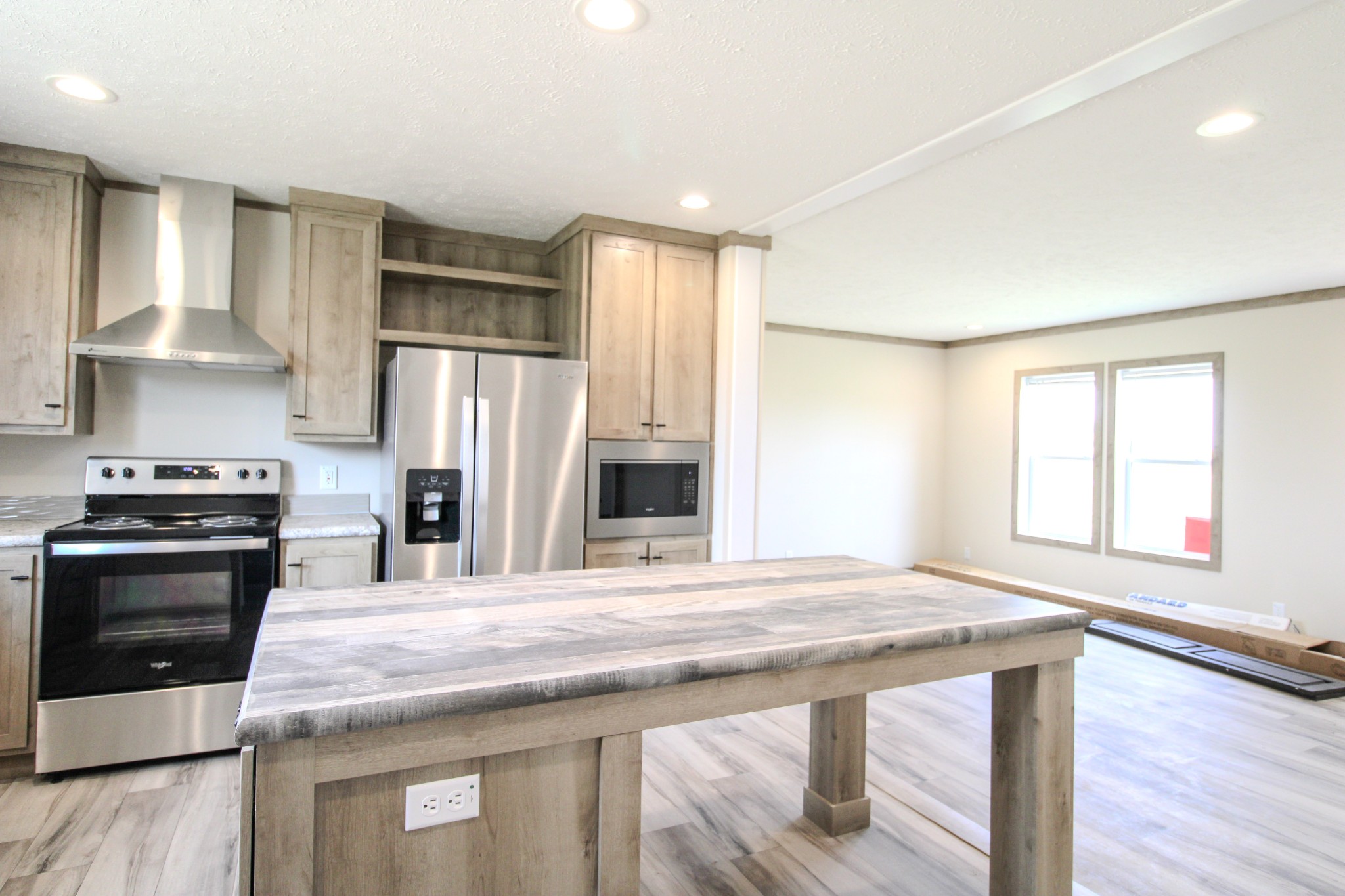 1143 Nimm Road Red Boiling Springs, TN 37150 - Photo 7 of 20 a kitchen with stainless steel appliances granite countertop a stove a refrigerator and a refrigerator