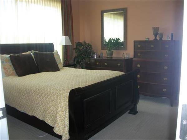 906 Alder Way, Unit 906 North Andover, MA 01845 - Photo 11 of 17 a bedroom with a bed and a mirror