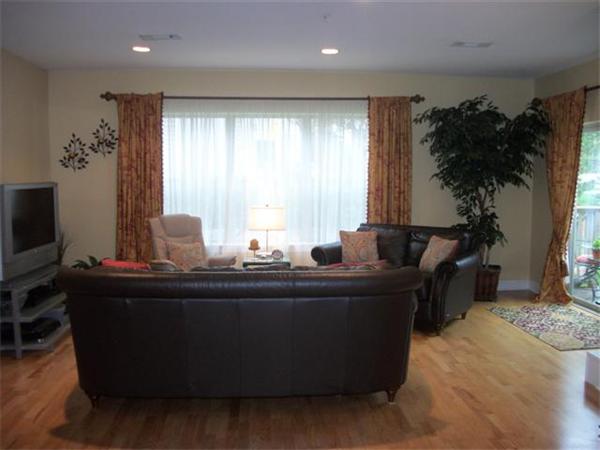 906 Alder Way, Unit 906 North Andover, MA 01845 - Photo 7 of 17 a living room with furniture and a flat screen tv