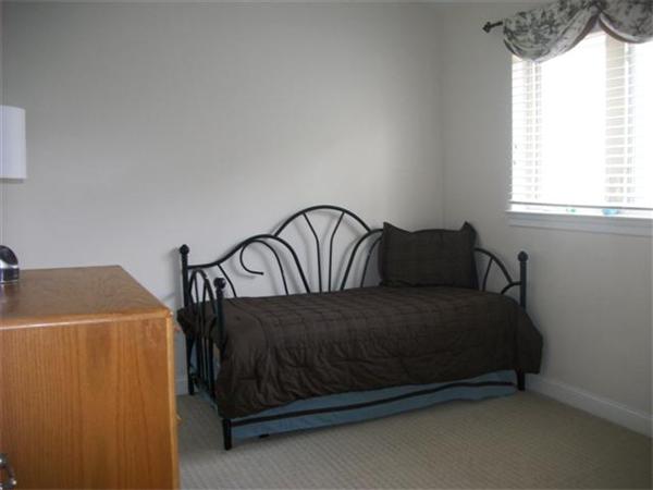 906 Alder Way, Unit 906 North Andover, MA 01845 - Photo 9 of 17 a bedroom with a bed and window