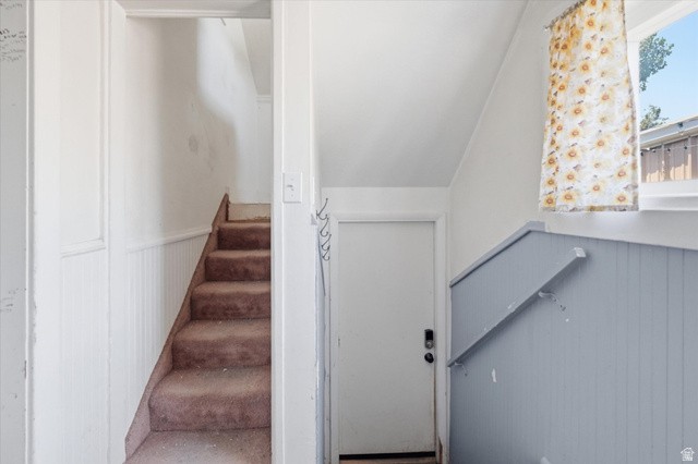 395 North 400 West Logan, UT 84321 - Photo 14 of 48 Carpeted staircase featuring white wall paneling