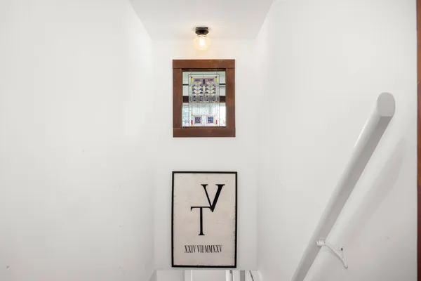 a view of a house with snow on the tree