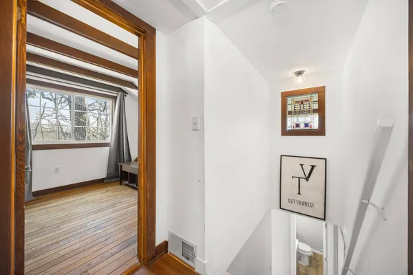 a view of an entryway with wooden floor