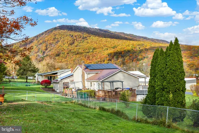 a view of a house with a big yard