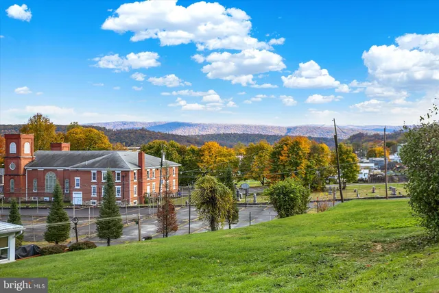 a view of a house with a big yard