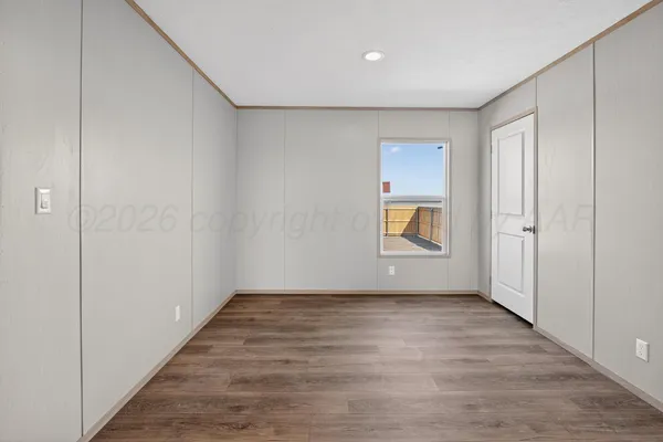 a view of a room with racks on the wall