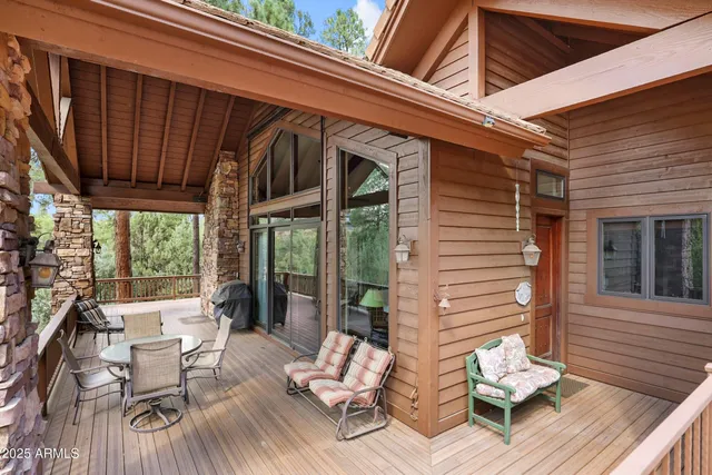 a living room with fireplace furniture and a flat screen tv