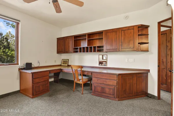 a room with furniture a sink a window and appliances