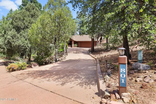 a view of a garden with an outdoor seating