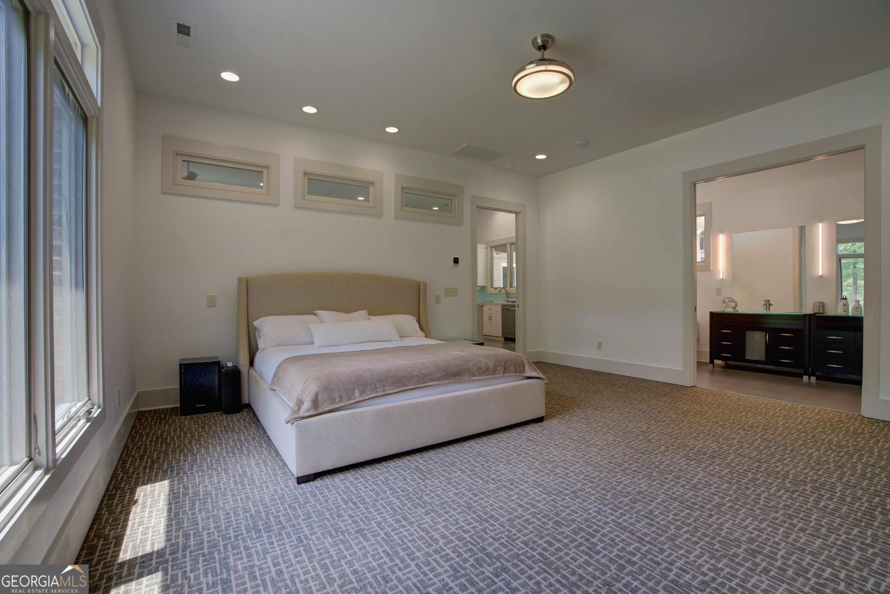 610 Kings Bridge Road Cave Spring, GA 30124 - Photo 16 of 72 a spacious bedroom with a bed and a large window