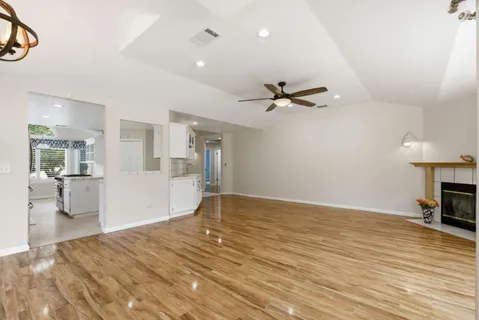 a kitchen that has a stove and a table in it