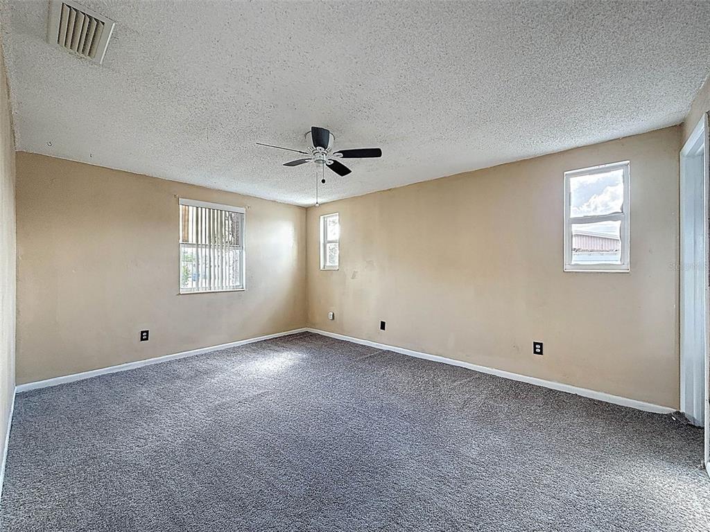 9381 Marler Road Spring Hill, FL 34608 - Photo 15 of 52 a view of an empty room with a window
