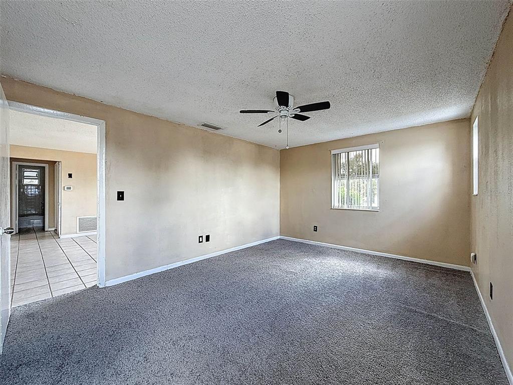 9381 Marler Road Spring Hill, FL 34608 - Photo 16 of 52 a view of an empty room with a window