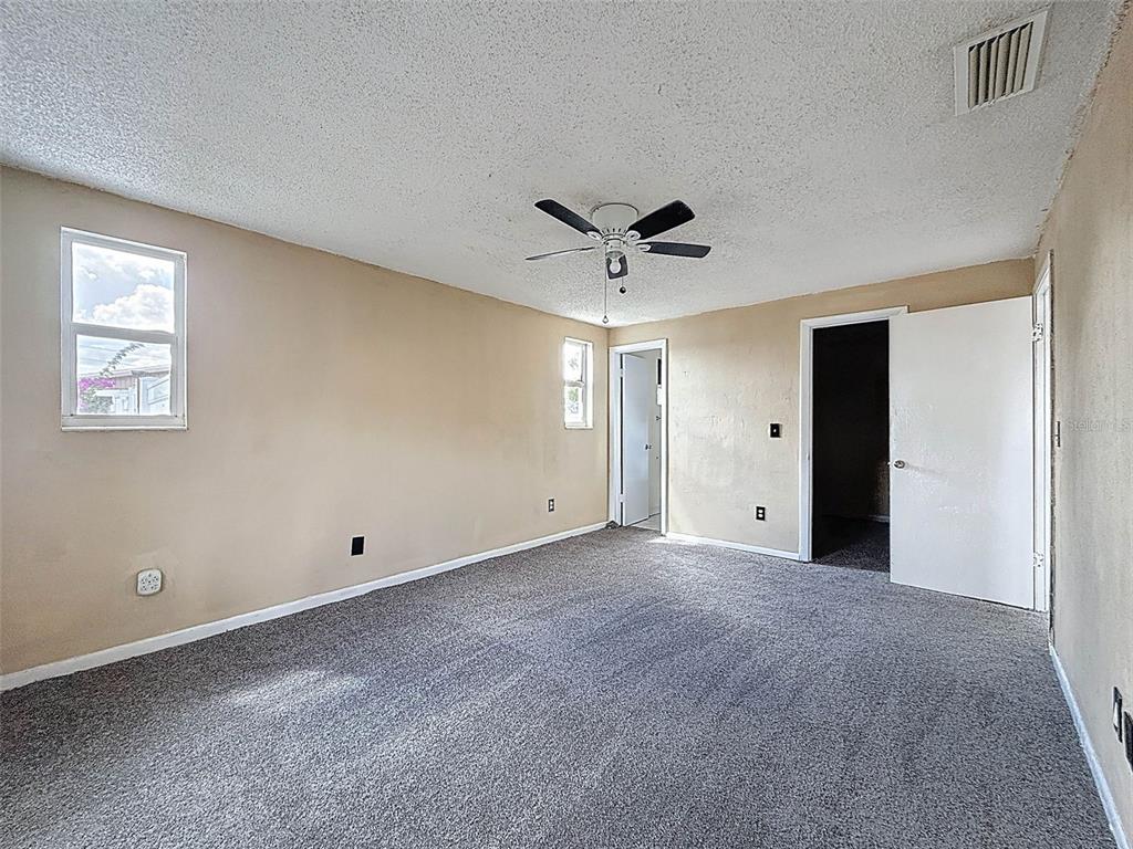 9381 Marler Road Spring Hill, FL 34608 - Photo 18 of 52 a view of an empty room with a window