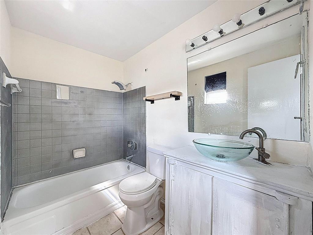 9381 Marler Road Spring Hill, FL 34608 - Photo 19 of 52 a bathroom with a sink a toilet and shower