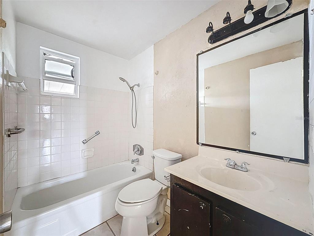 9381 Marler Road Spring Hill, FL 34608 - Photo 23 of 52 a bathroom with a sink a toilet and shower