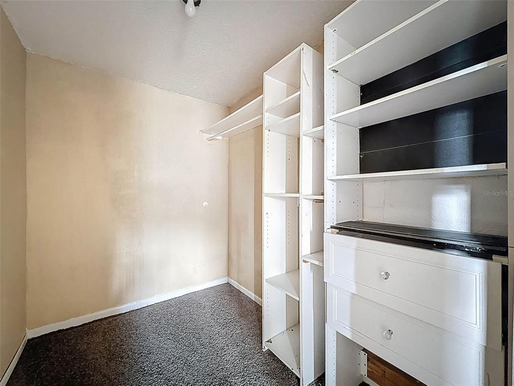 9381 Marler Road Spring Hill, FL 34608 - Photo 24 of 52 a kitchen with white cabinets and white appliances