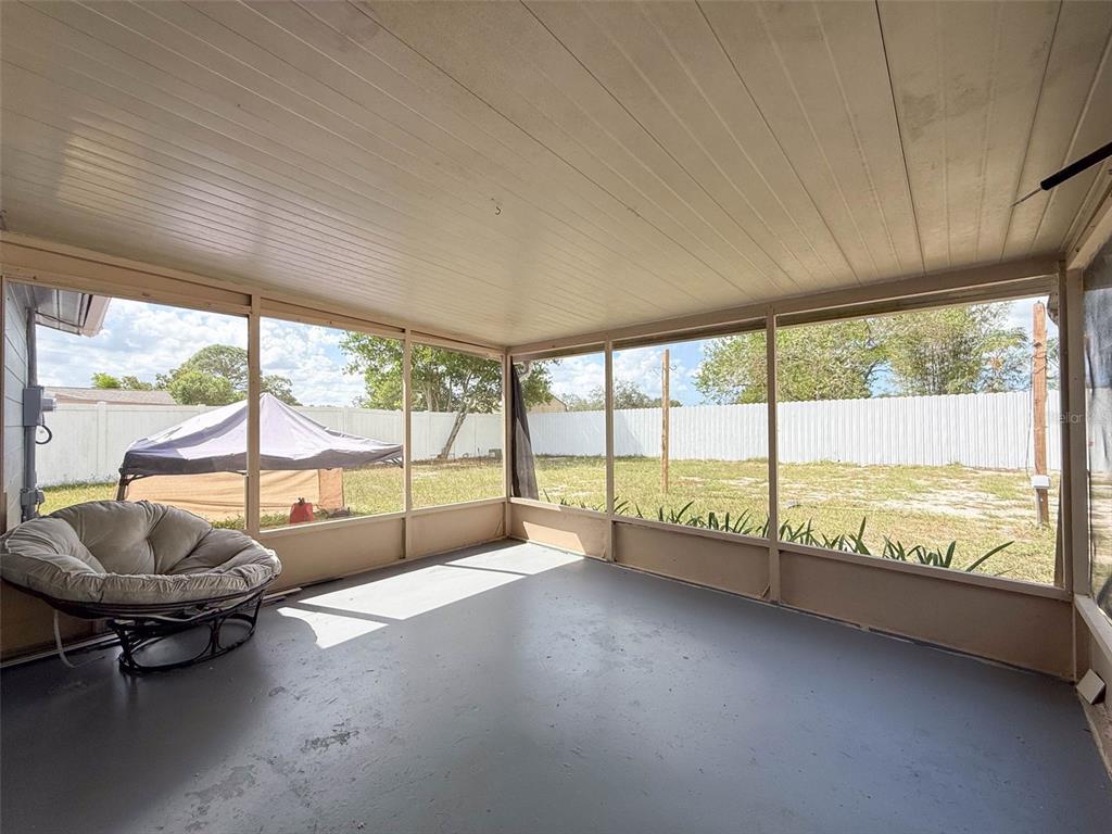 9381 Marler Road Spring Hill, FL 34608 - Photo 27 of 52 a view of an empty room with large windows