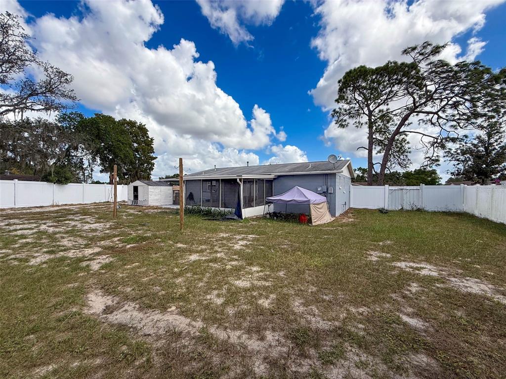 9381 Marler Road Spring Hill, FL 34608 - Photo 30 of 52 a view of a house with a yard