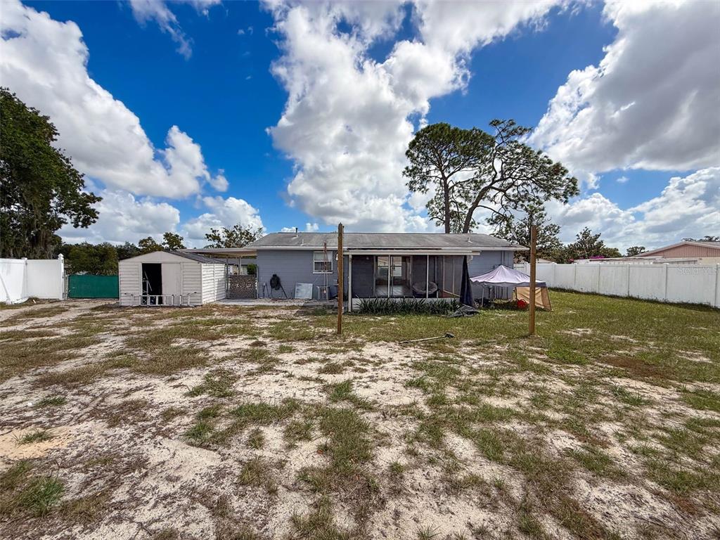 9381 Marler Road Spring Hill, FL 34608 - Photo 31 of 52 a view of a house with a yard