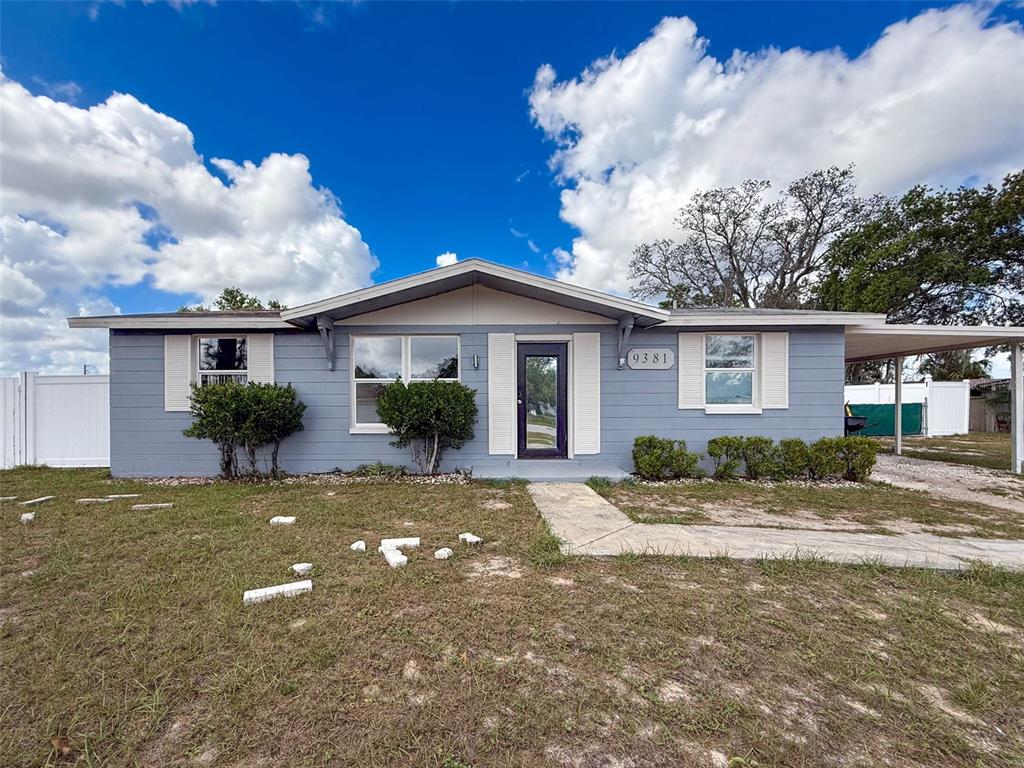 9381 Marler Road Spring Hill, FL 34608 - Photo 34 of 52 a front view of a house with garden