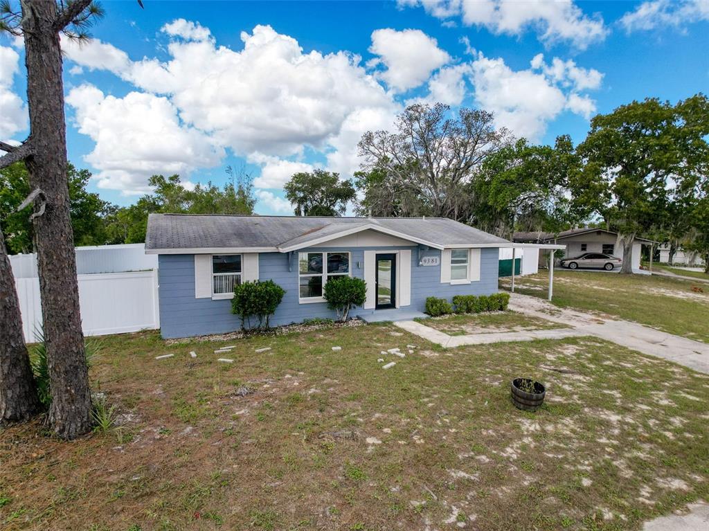 9381 Marler Road Spring Hill, FL 34608 - Photo 35 of 52 a view of a house with backyard and trees