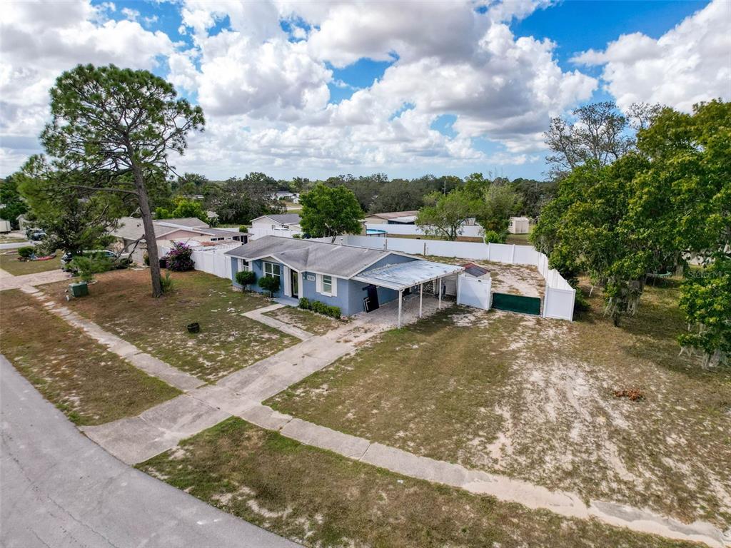 9381 Marler Road Spring Hill, FL 34608 - Photo 39 of 52 a view of a house with backyard and sitting area