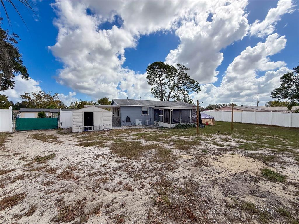 9381 Marler Road Spring Hill, FL 34608 - Photo 40 of 52 a view of a house with a yard