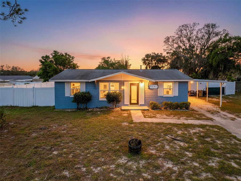9381 Marler Road Spring Hill, FL 34608 - Photo 4 of 52 front view of a house with a yard