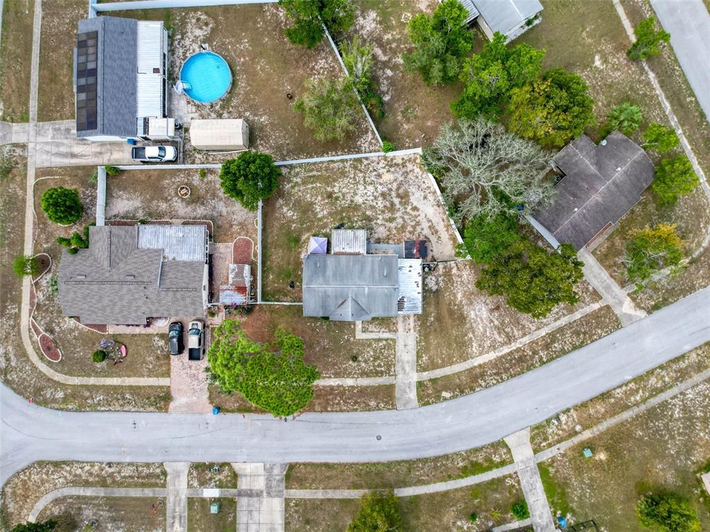 9381 Marler Road Spring Hill, FL 34608 - Photo 42 of 52 an aerial view of a house with a swimming pool