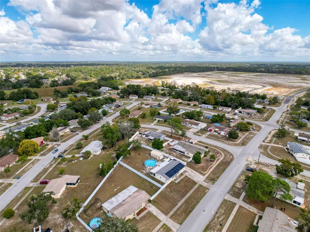 9381 Marler Road Spring Hill, FL 34608 - Photo 46 of 52 an aerial view of residential building with swimming pool and ocean view